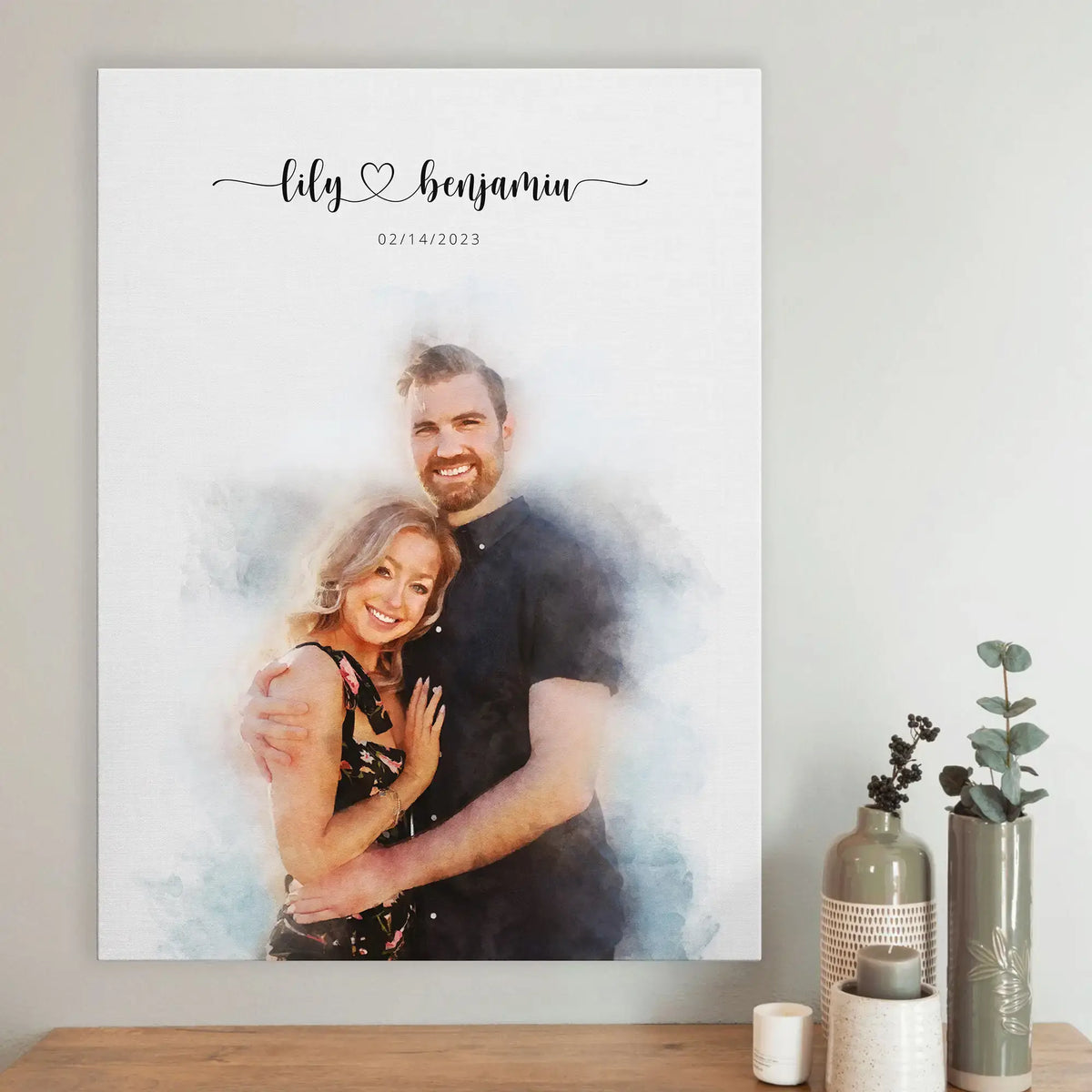 Watercolor-style portrait of a smiling couple on canvas, the man in a dark shirt, above a shelf with vases and a candle