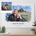 A man and woman smiling at Mont St. Michel in a snapshot, beside their watercolor-style portrait printed on canvas