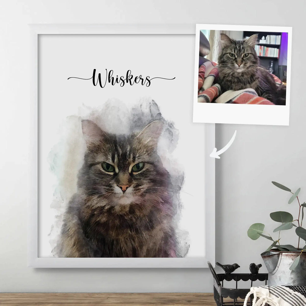 Watercolor-style portrait of a brown tabby cat named 'Whiskers' in a white frame, beside the reference photo