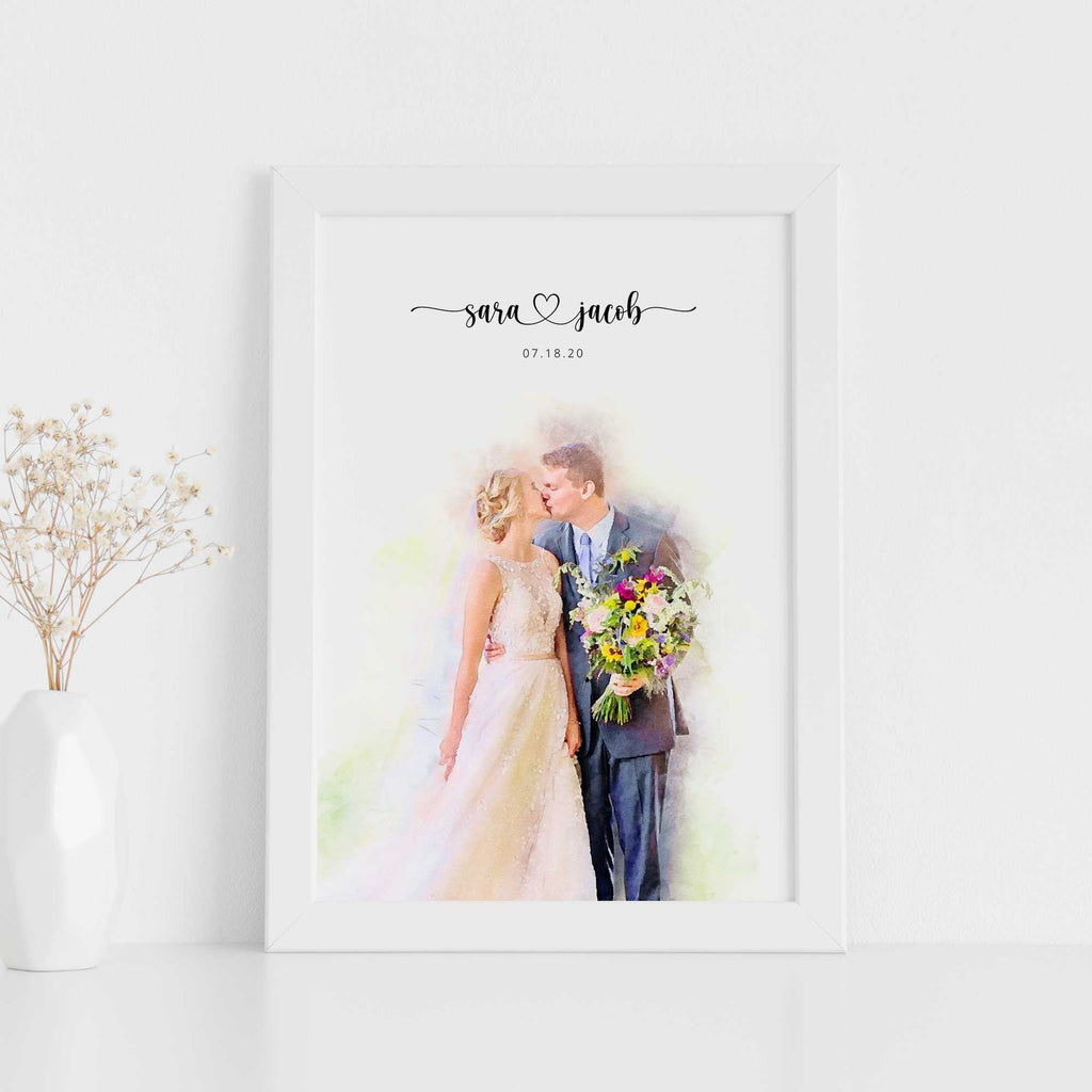 Watercolor-style wedding portrait of a bride and groom kissing, he holds a bouquet, names and date above, in a white frame