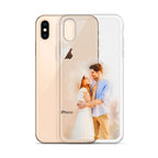 Clear iPhone XS Max case printed with a watercolor-style portrait of a couple embracing, beside a gold iPhone